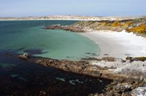 The beautiful sandy beach ay Gypsy Cove